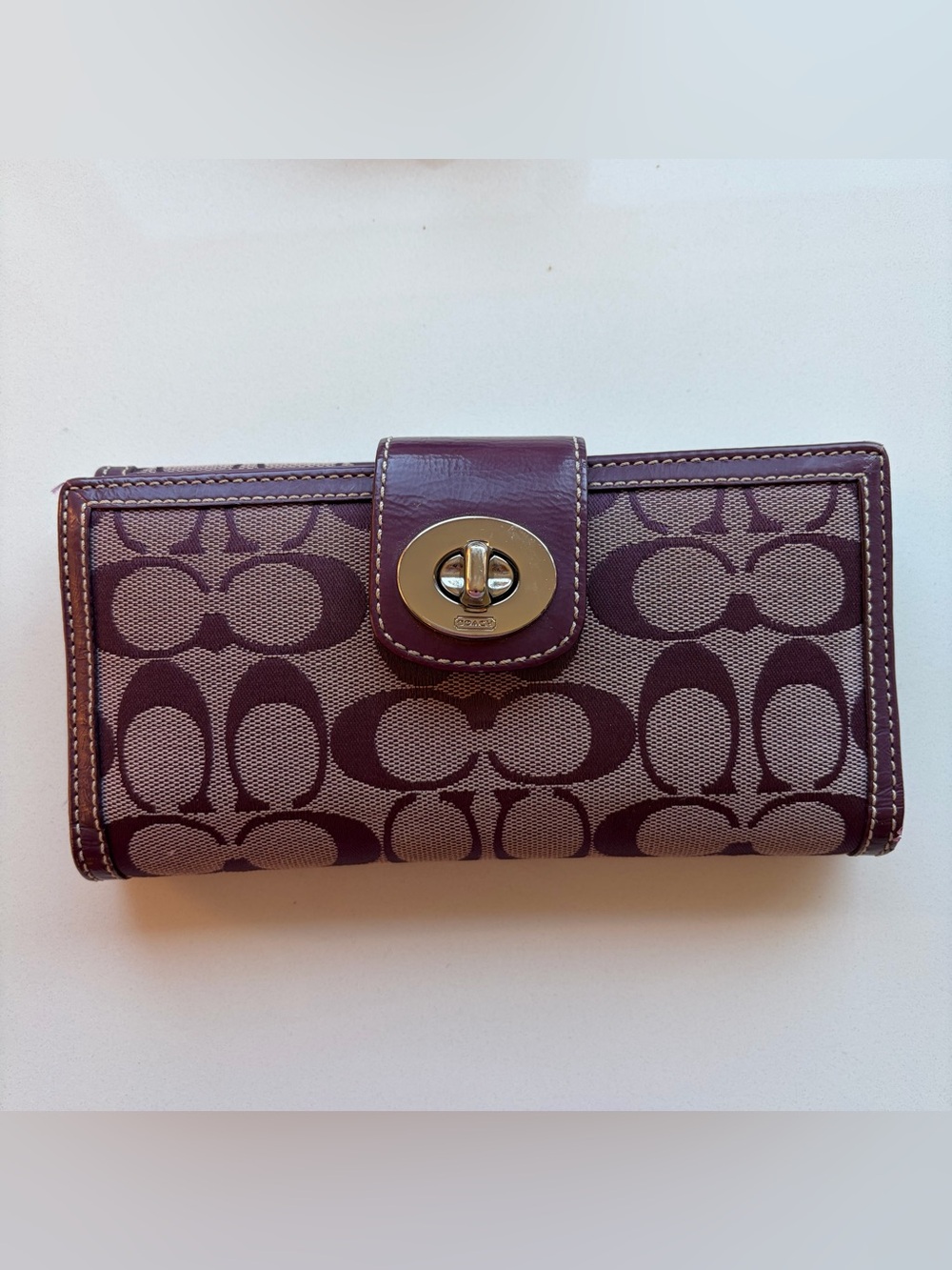 Coach Signature Canvas Turn-Lock Continental Wallet in Plum